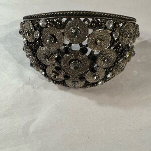 Cuff style costume jewelry bracelet w/dark metal finish/stone embellishments